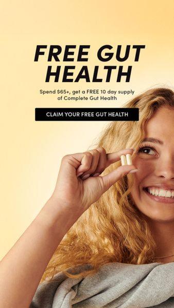 This advertisement features a bright, clean, human-centric aesthetic where a user holds a capsule to visualize the gut health supplement clearly.